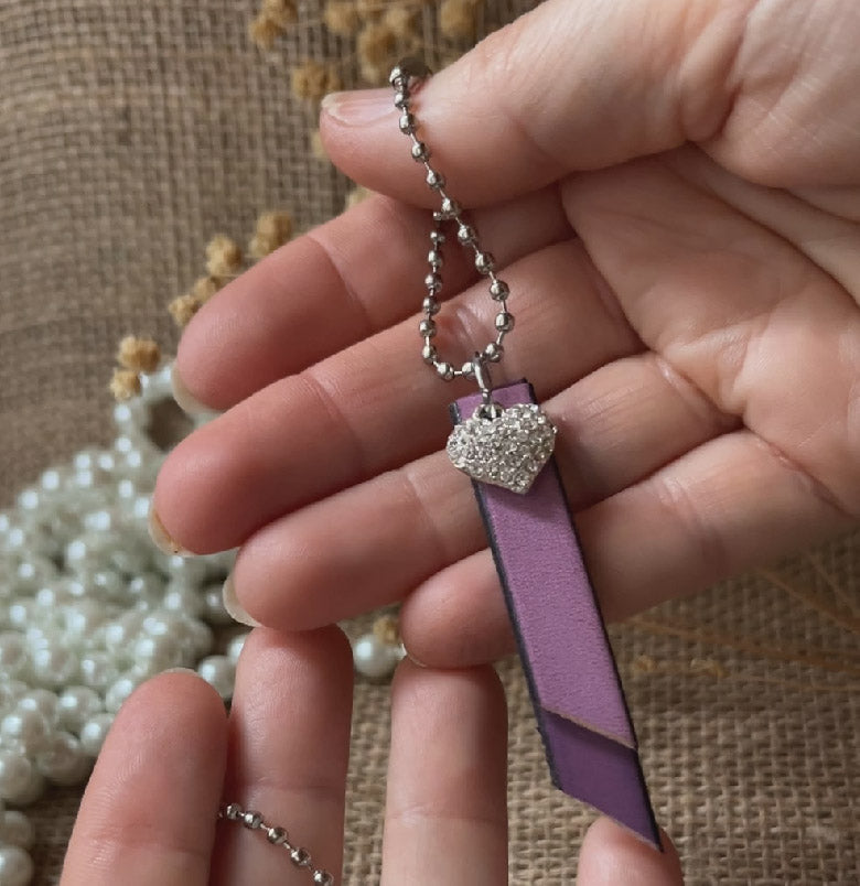 Porte clé duo de cuirs et charme