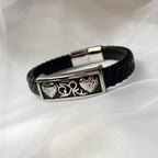 Bracelet cuir noir tressé à plaque métallique 2 coeurs gravés