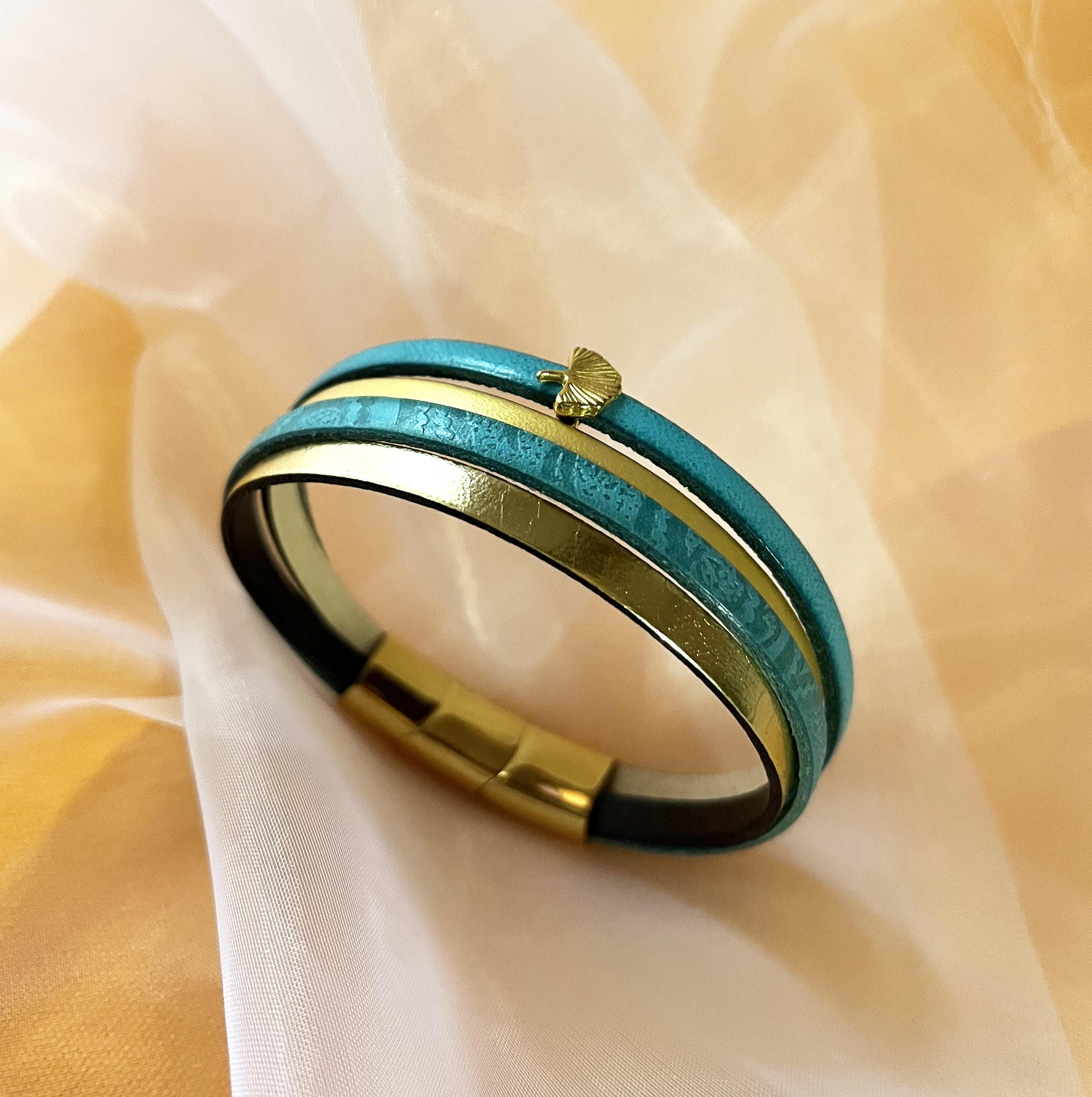 Bracelet manchette femme aux 4 cuirs turquoises et dorés décor feuille ginkgo