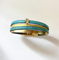 Bracelet manchette femme aux 4 cuirs turquoises et dorés décor feuille ginkgo