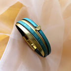 Bracelet manchette femme aux 4 cuirs turquoises et dorés décor feuille ginkgo