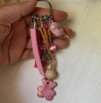 Bijou de sac multi breloques nounous rose et message cuir gravé