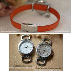 Montre femme cadran argenté bracelet cuir avec breloque pendentif