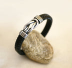 bracelet homme noeud infini en acier sur cuir tressé noir fermoir magnétique avec extension amovible