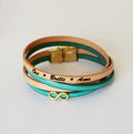 Bracelet femme duo de cuirs en double tour avec breloque infini doré à personnaliser