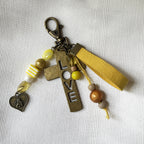 Bijou de sac Croix bronze multi breloques en perles jaunes