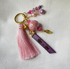 Bijou de sac doré multi breloques en perles Rose et message cuir gravé