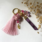 Bijou de sac doré multi breloques en perles Rose et message cuir gravé